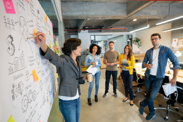 Woman making business presentation at a creative office