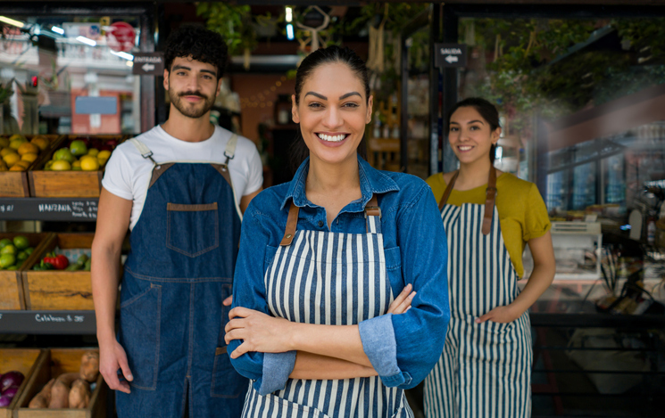 Group of employees at a small food market